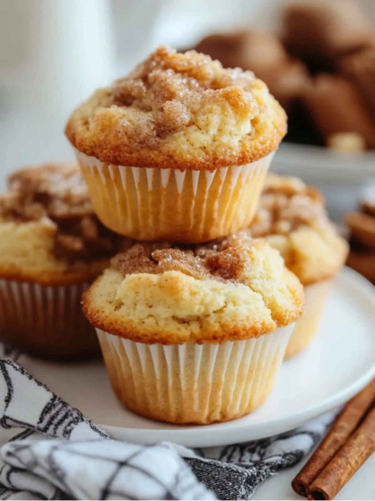 Swirled Cinnamon and Sugar Muffins: Delicious Homemade Treats Swirled Cinnamon and Sugar Muffins Freshly baked cinnamon sugar muffins arranged on a rustic wooden table, showcasing a golden-brown crust with swirls of cinnamon and sugar, soft fluffy texture, warm steam rising, surrounded by a sprinkle of cinnamon and a small bowl of sugar, with a cozy kitchen backdrop. Start your day with warm, homemade muffins that fill your kitchen with cinnamon and sugar. These muffins turn a regular morning into a special treat. They mix the comfort of sweet pastry with a spicy cinnamon swirl. Making these tasty breakfast treats is simple. You just need a few ingredients and basic baking skills. They're perfect for a quick breakfast or a delicious snack. These cinnamon sugar muffins will soon be your favorite recipe. Key Takeaways Perfect blend of sweet and spicy flavors Simple recipe with minimal preparation time Versatile breakfast or snack option Easily customizable with different toppings Can be stored for several days or frozen The Perfect Blend of Cinnamon and Sugar in Every Bite Explore the magical world of cinnamon sugar blend. It turns simple muffins into amazing treats. The mix of cinnamon and sugar creates a taste experience that excites your senses and brings comfort with each bite. Cinnamon Sugar Muffin Flavor Profile A close-up view of freshly baked cinnamon sugar muffins, golden-brown with a perfectly swirled topping of cinnamon and sugar, soft and fluffy texture visible inside, sprinkled with fine sugar crystals, surrounded by warm spices such as cinnamon sticks and a light dusting of powdered sugar on a rustic wooden table. Understanding the Classic Flavor Combination The sweet and spicy mix of cinnamon sugar is a wonder in the kitchen. It has pleased bakers for many years. This blend offers a taste that is both warm and slightly zingy. Cinnamon adds a rich, aromatic warmth Sugar brings a sweet delight Together, they make a perfectly balanced flavor The Science Behind Sweet and Spicy Balance The science behind cinnamon sugar is fascinating. The cinnamaldehyde in cinnamon and sugar's sweetness create a unique taste. This interaction makes the muffins hard to resist. "Cinnamon is not just a spice, it's a culinary experience that bridges sweet and spicy in perfect harmony." Why These Muffins Stand Out Your homemade cinnamon sugar muffins are special. They use a precise swirl technique to spread flavor evenly. Unlike regular muffins, these offer a consistent taste from start to finish. Consistent flavor distribution Perfectly balanced sweet and spicy notes Moisture-rich texture Essential Ingredients for Bakery-Style Results Muffin Ingredients for Bakery-Style Baking An assortment of fresh ingredients for baking cinnamon and sugar muffins, including a bowl of flour, a jar of sugar, a stick of butter, eggs, ground cinnamon, and a measuring cup filled with milk, all arranged artistically on a rustic wooden kitchen counter, with some scattered cinnamon sticks and sugar granules for added texture. Creating bakery-style muffins starts with the right ingredients. Quality makes a big difference. Your cinnamon sugar muffins will stand out with the right choices. Here are the key ingredients for top-notch results: Flour Foundation: 2 cups of all-purpose flour provides the perfect base Unsalted butter (1/2 cup) for rich flavor Granulated sugar (3/4 cup) for sweetness Fresh eggs (2 large) for structure Baking powder (1 tablespoon) for perfect rise "The secret to bakery-style muffins lies in precision and quality ingredients." - Professional Baker's Wisdom Moisture is key for tender muffins. Adding sour cream (1/2 cup) and milk (1/2 cup) helps. They make your muffins soft and delicious. The cinnamon sugar swirl is a game-changer. Mix 3/4 cup sugar with 1 tablespoon of cinnamon. It turns your muffins into a bakery favorite, right in your kitchen. Swirled Cinnamon and Sugar Muffins: Step-by-Step Recipe Making the perfect muffin recipe takes skill and love. Turn your kitchen into a bakery with these tasty swirled cinnamon and sugar muffins. They will excite your taste buds and wow your family. Preparing the Cinnamon Sugar Filling Your cinnamon sugar filling is the key to these muffins. Mix 1/2 cup light brown sugar with 3 teaspoons of ground cinnamon. This mix creates a sweet, spicy swirl that makes your muffins stand out. Mix brown sugar and cinnamon thoroughly Use a fork to break up any sugar clumps Set aside for layering in the batter Creating the Perfect Muffin Batter A great muffin batter needs the right ingredients and mixing. Mix 1 3/4 cups all-purpose flour with 1/2 cup old-fashioned oats. This creates a strong base for your muffins. Blend dry ingredients separately Whisk wet ingredients until smooth Gently fold wet and dry ingredients together Mastering the Swirl Technique The swirl technique turns a simple muffin into a masterpiece. Fill muffin cups with batter, add cinnamon sugar filling, and top with more batter. "The magic happens when you create beautiful, consistent swirls in each muffin" - Baking Experts Use a toothpick or skewer to make marbled patterns. This ensures each bite has the right mix of muffin and cinnamon sugar. Bake at 350°F for 20 minutes. You'll get 12 delicious muffins that will be a hit with your family. Streusel Topping and Cream Cheese Glaze Make your cinnamon sugar muffins even better with streusel topping and cream cheese glaze. These toppings turn a simple baked good into a fancy treat that will wow your guests. The streusel topping adds a crunchy texture and more sweetness. Here's how to make the perfect streusel topping: ½ cup all-purpose flour ⅓ cup white sugar ½ stick softened butter ½ teaspoon ground cinnamon ¼ teaspoon salt Mix these ingredients until they're crumbly. Sprinkle about 2-3 teaspoons over each muffin before baking for the best taste and texture. For an extra special touch, add a cream cheese glaze. This topping adds a tangy richness that complements the cinnamon: 8 oz cream cheese ¼ cup white sugar ½ teaspoon vanilla extract 2-3 tablespoons milk (for desired consistency) "The secret to an amazing muffin is in its topping!" - Baking Enthusiasts Drizzle the cream cheese glaze over cooled muffins for a fancy bakery look. These toppings not only look great but also add more flavor and texture, making your homemade treats unforgettable. Professional Baking Tips and Techniques Mastering muffin baking is more than just a recipe. Professional bakers use special techniques to make their treats stand out. Here are some expert tips to improve your muffin-making skills. Temperature Control Secrets Oven temperature is key for perfect muffins. Start by heating your oven to 425°F for 5 minutes. Then, lower it to 375°F. This method helps create tall, dome-like muffin tops. Mixing Methods for Perfect Texture The right mixing technique is crucial for great muffin texture. Follow these tips for light and fluffy muffins: Mix dry and wet ingredients separately Fold ingredients gently - do not overmix Stop mixing when ingredients are just combined Use room temperature ingredients for better integration Storage and Freshness Guidelines Proper storage keeps your muffins fresh. Here are some tips: Store at room temperature in an airtight container Consume within 2-3 days for best taste Freeze for up to 3 months in a sealed freezer bag Thaw at room temperature or reheat at 350°F for 10 minutes "The difference between a good muffin and a great muffin is in the details." - Professional Baker's Wisdom Variations and Creative Twists Exploring muffin variations can turn your classic cinnamon sugar recipe into a fun adventure. Creative baking lets you add unique flavors that will amaze your taste buds. Here are some tasty ways to make your muffins special: Fruit Infusions: Blueberry swirl muffins Diced apple cinnamon version Raspberry chocolate chip blend Nutty Additions: Chopped pecans Sliced almonds Walnut crumble topping Exotic Spice Combinations: Cardamom and orange zest Nutmeg and vanilla Ginger and maple glaze If you follow special diets, you can still enjoy these muffins. Use gluten-free flour or non-dairy milk. Vegans can use flax seeds or applesauce instead of eggs. *Baking is an art of experimentation - don't be afraid to add your personal touch!* For great muffin variations, keep the right moisture and texture. Start with small changes and adjust as needed for the best taste. Conclusion Your journey to making tasty cinnamon sugar treats is just starting. These homemade muffins are more than a recipe. They open the door to baking success, turning your kitchen into a cozy bakery. With every cinnamon swirl and sugar sprinkle, you've picked up valuable skills. These skills turn simple ingredients into amazing baked goods. The beauty of these muffins is their ease and flexibility. Whether you're new to baking or have lots of experience, this guide helps you make delicious treats. These treats will wow your family and friends. Remember, baking is all about practice and passion. Feel free to add your own twist with blueberries, chocolate chips, or nuts. This makes the recipe truly yours. We encourage you to share your baking stories and special touches. Post pictures of your cinnamon sugar muffins on social media. Tag your favorite baking groups. Your creativity could inspire others to start their own baking journeys. So, it's time to fire up the oven, get your ingredients ready, and make memories with every muffin. Happy baking! FAQ Can I make these muffins ahead of time? Absolutely! You can make the muffins up to 2 days in advance. Store them in an airtight container at room temperature. Or, freeze them for up to 3 months. When freezing, wrap each muffin in plastic wrap. Then, put them in a freezer-safe bag. This keeps them fresh and moist. How can I ensure my muffins don't become dry? To keep muffins moist, avoid overmixing the batter. Mix ingredients just until they're combined. Use the toothpick test to check if they're done - a few moist crumbs are fine. Also, using buttermilk or sour cream helps a lot. They keep the muffins moist and delicious. Can I make these muffins gluten-free? Yes! Use a gluten-free flour blend instead of all-purpose flour. Make sure the blend includes xanthan gum for better texture. Also, check that all other ingredients are gluten-free. What's the best way to create the perfect cinnamon sugar swirl? Use a butter knife or skewer to swirl the batter gently. Make sure to not overmix. You want to see distinct cinnamon sugar ribbons in the muffin. How long do these muffins stay fresh? These muffins stay fresh for 2-3 days in an airtight container at room temperature. You can refrigerate them for up to 5 days to keep them longer. Always let refrigerated muffins come to room temperature before serving. This ensures the best flavor and texture. Can I substitute the sugar in this recipe? Yes, you can try different sweeteners. Brown sugar adds a rich flavor, while coconut sugar offers a more complex sweetness. For less sugar, use a sugar substitute made for baking. What if I don't have a muffin tin? No problem! You can use a cake pan or cast-iron skillet to make a large cake. Adjust the baking time as needed. Keep an eye on it, as different pans cook differently.